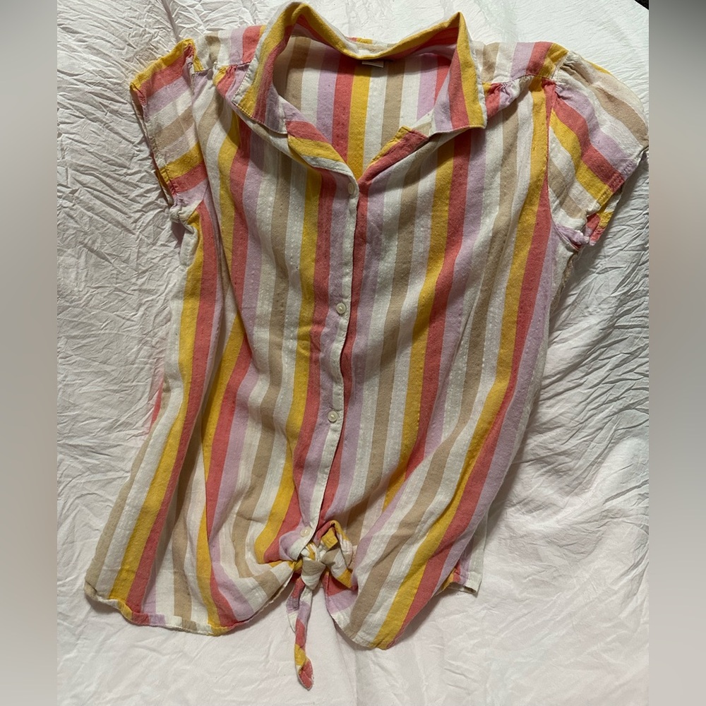 Red, pink, crème, and white shirt with striped and four buttons.